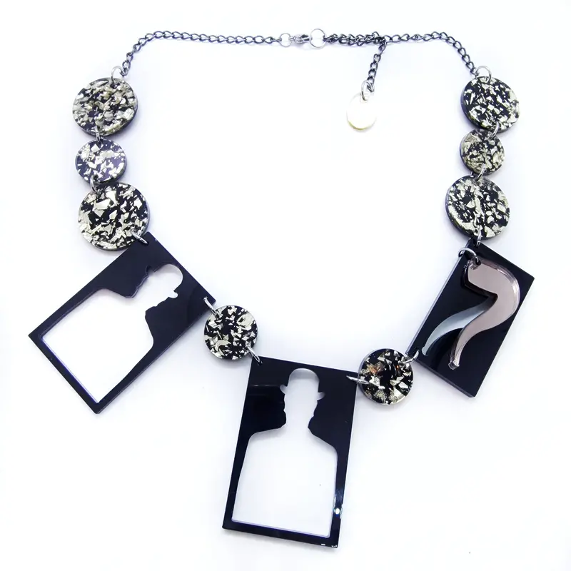 Surrealist Pipe and Silhouette Pendant