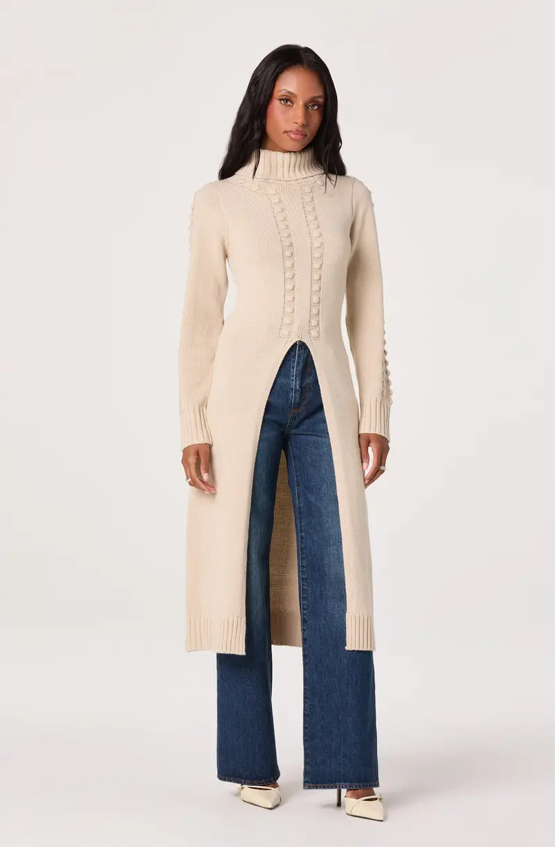 Turtleneck Sweater with Asymmetrical Split Hem and Extended Length